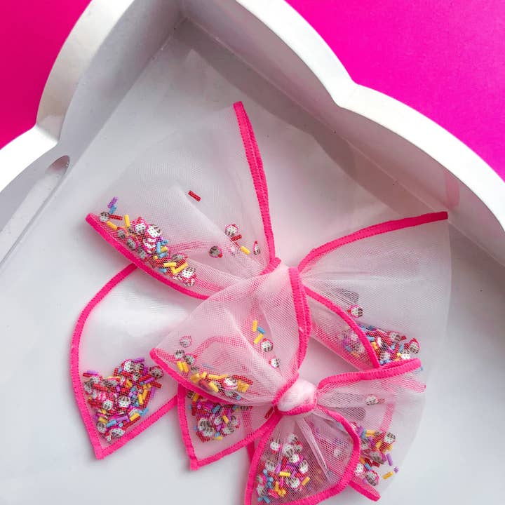 Cupcakes & Confetti Shaker Bow for wholesale by Sparkling New Baby, LLC.