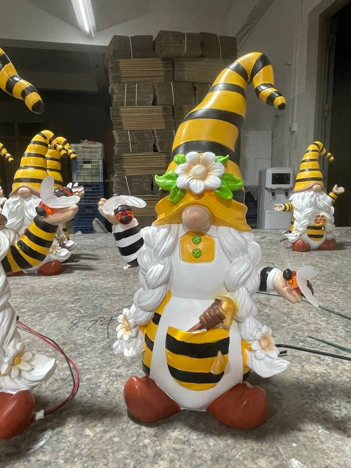 Bee Lady with Honey Dipper Solar Powered bee statue for wholesale by By Mark & Margot