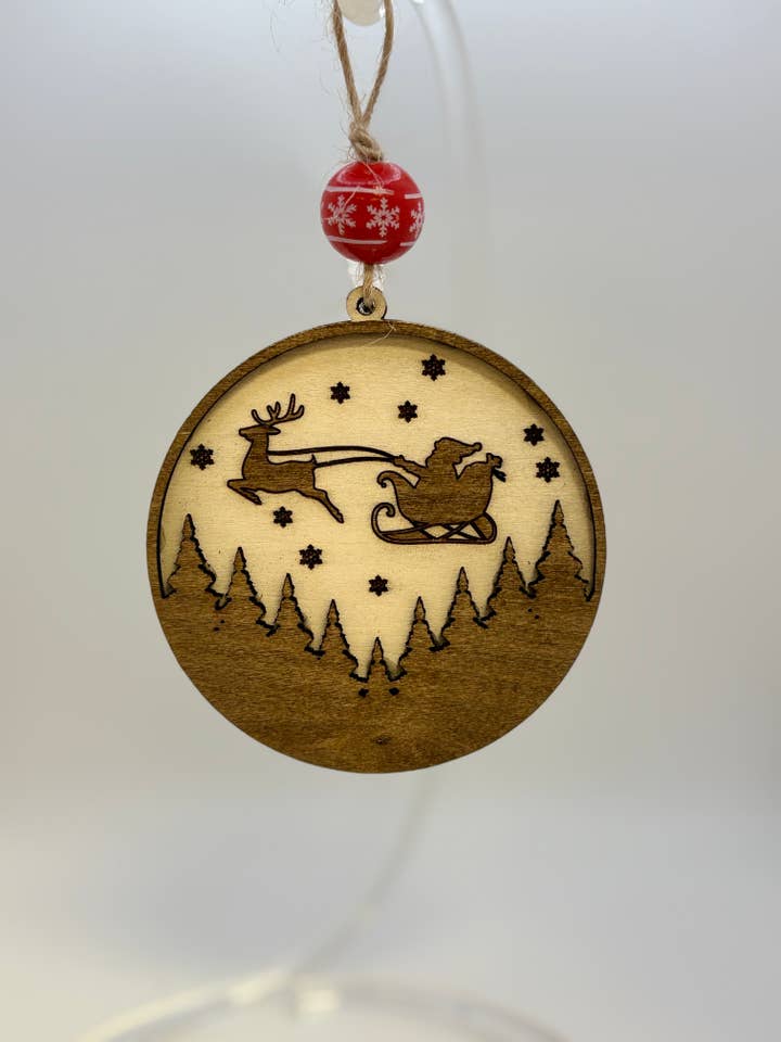 Layered “Santa Over the Woods” Ornament for wholesale by Chickadee Woods Designs, LLC