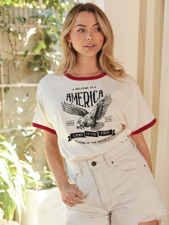 Top graphique WELCOME TO AMERICA Ringer pour la vente par OAT COLLECTIVE