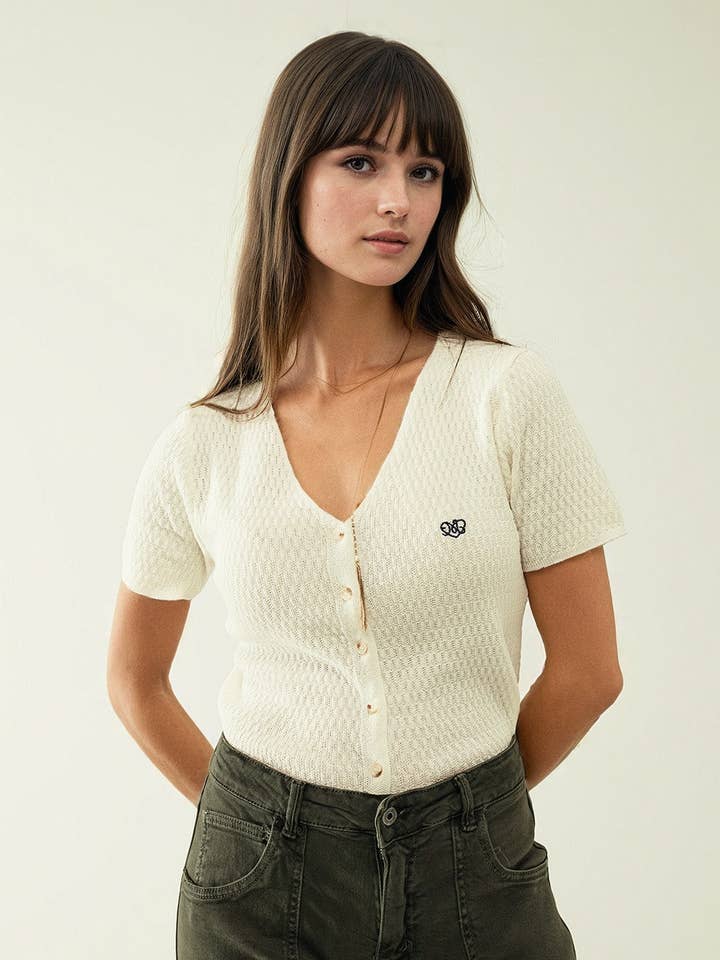 White cardigan with short sleeves and front closure with but for wholesale by Q2—All Orders:Free Duties for the US,UK,and Canada