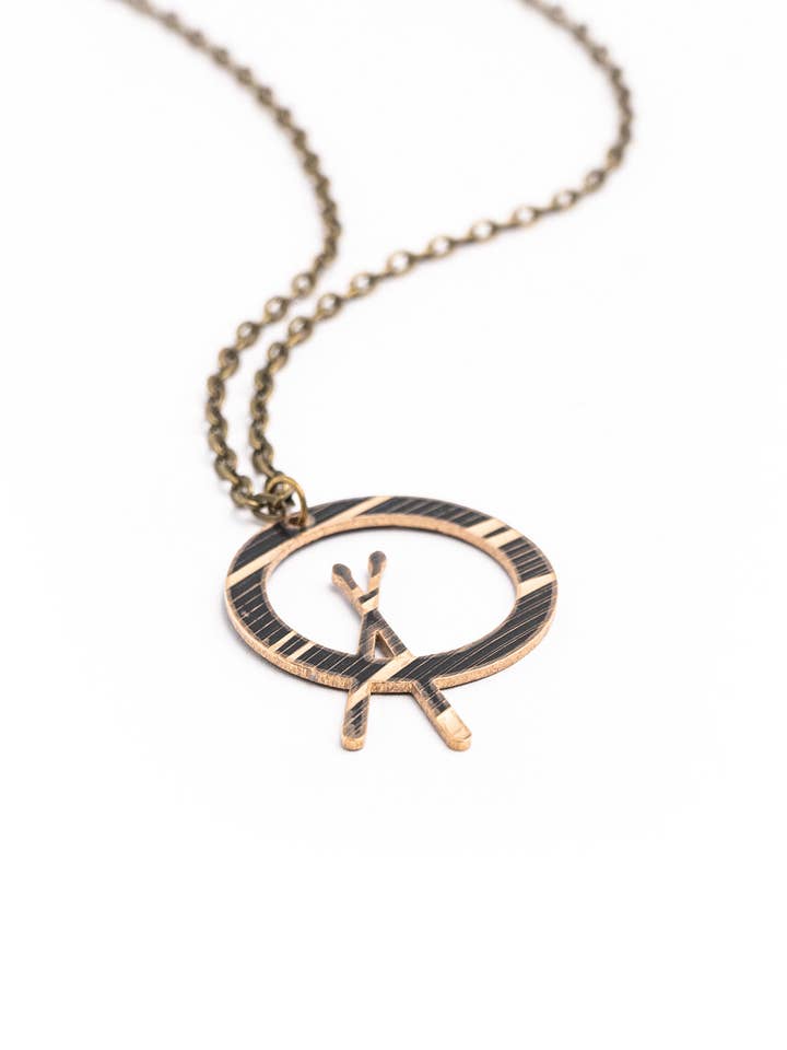Dark Cross Stick - Reclaimed Cymbal Necklace for wholesale by Full Circle Co.
