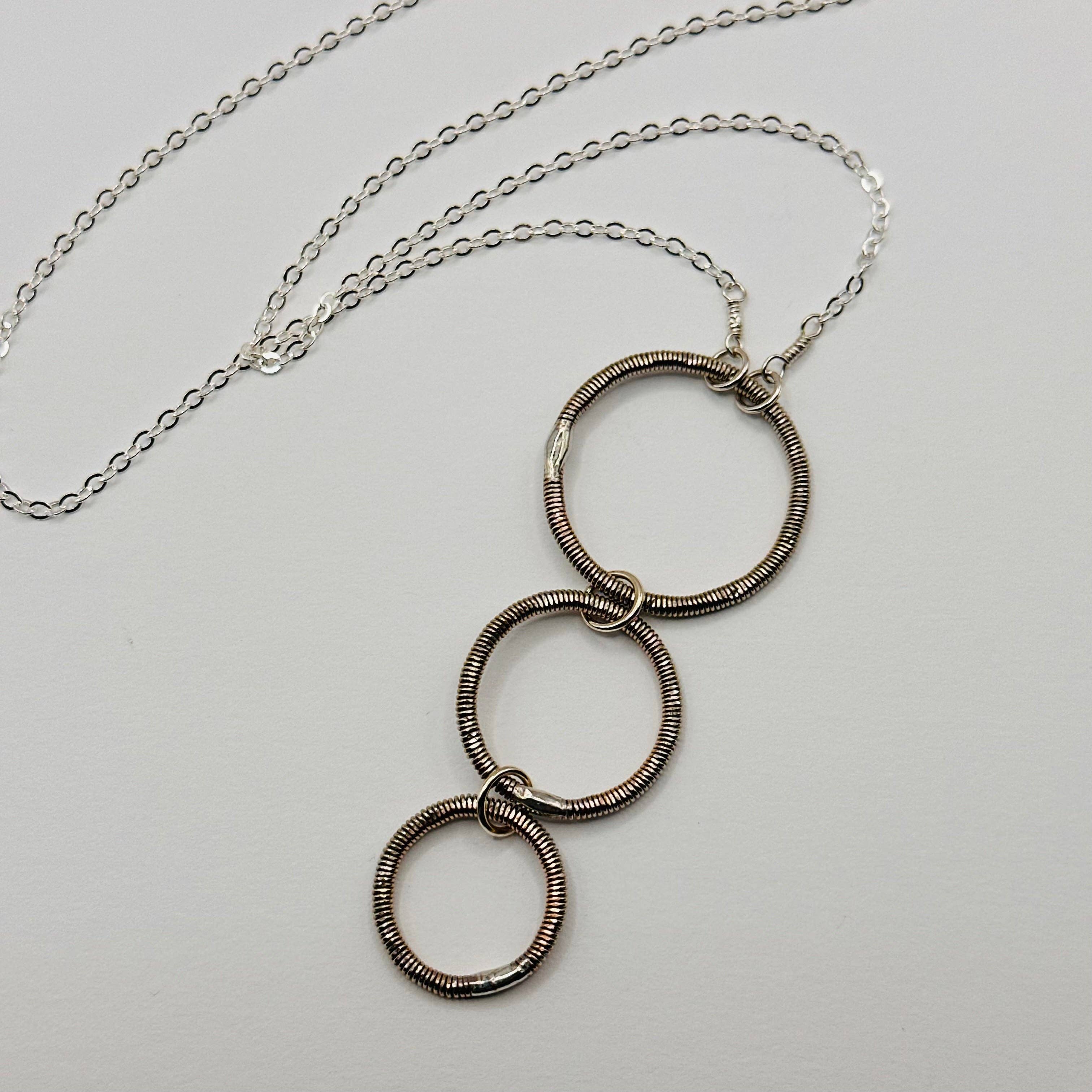 Middle Sister Designs - Wholesale Pendant/Charm Necklace - Long Triple Circle Bass String Necklace1