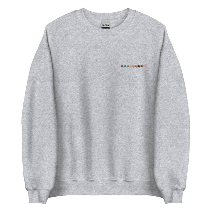 Progressive Pride Rainbow Hearts Embroidered Unisex Sweatshirt for wholesale by Gay Pride Apparel