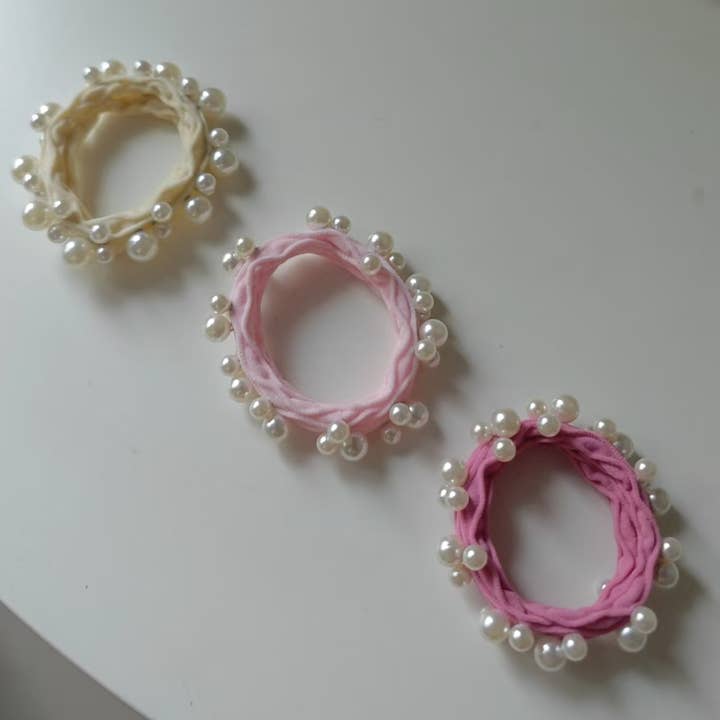 Assorted Pink Textured Seamless Pearl Hair Ties (Set of 6) for wholesale on Faire4