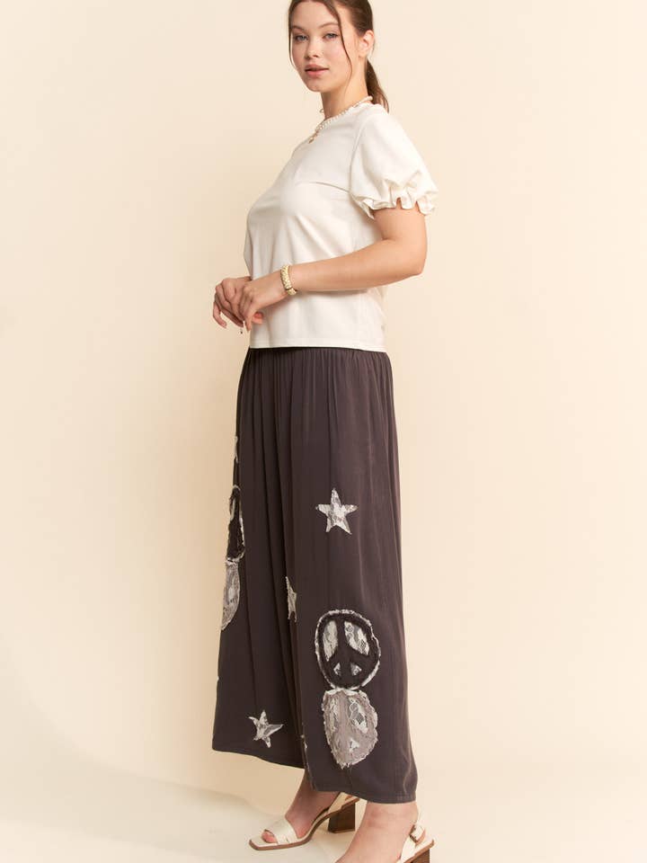 Charcoal PEACE AND STAR PATCHWORK LEG PANTS for wholesale on Faire5