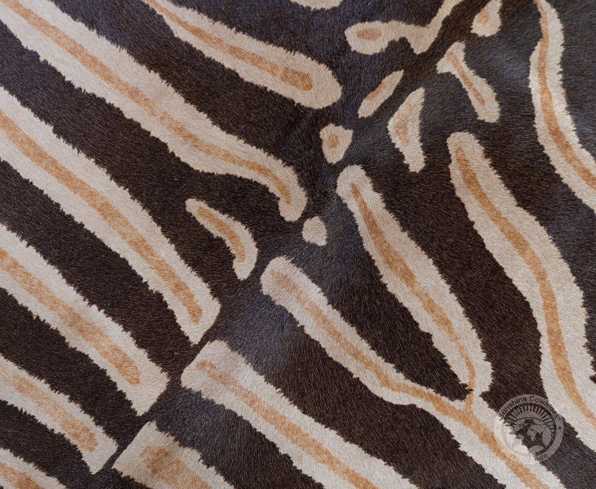 Brown Wild Zebra Stripes on Beige Cowhide Rug for wholesale on Faire1