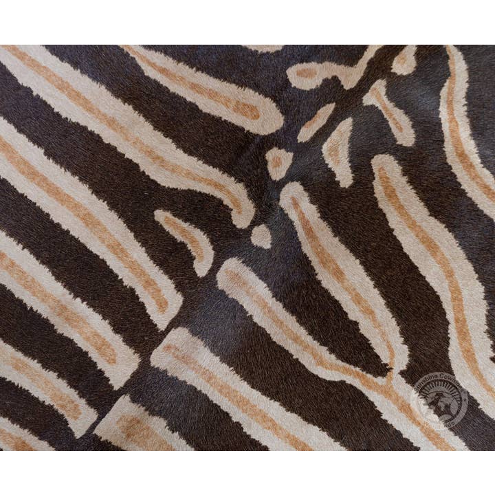 Brown Wild Zebra Stripes on Beige Cowhide Rug for wholesale on Faire1