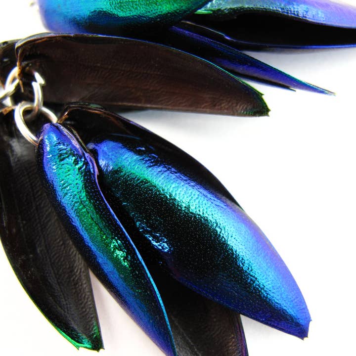 Tika – Engroshandel Hængeøreringe og creoløreringe – Øreringe med smaragdgrønne billevinger1