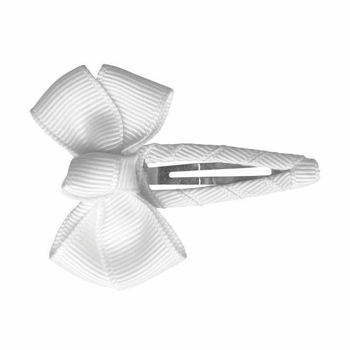 Estelle hair bow with hair clip in warm white for wholesale by La Fillette Accessories