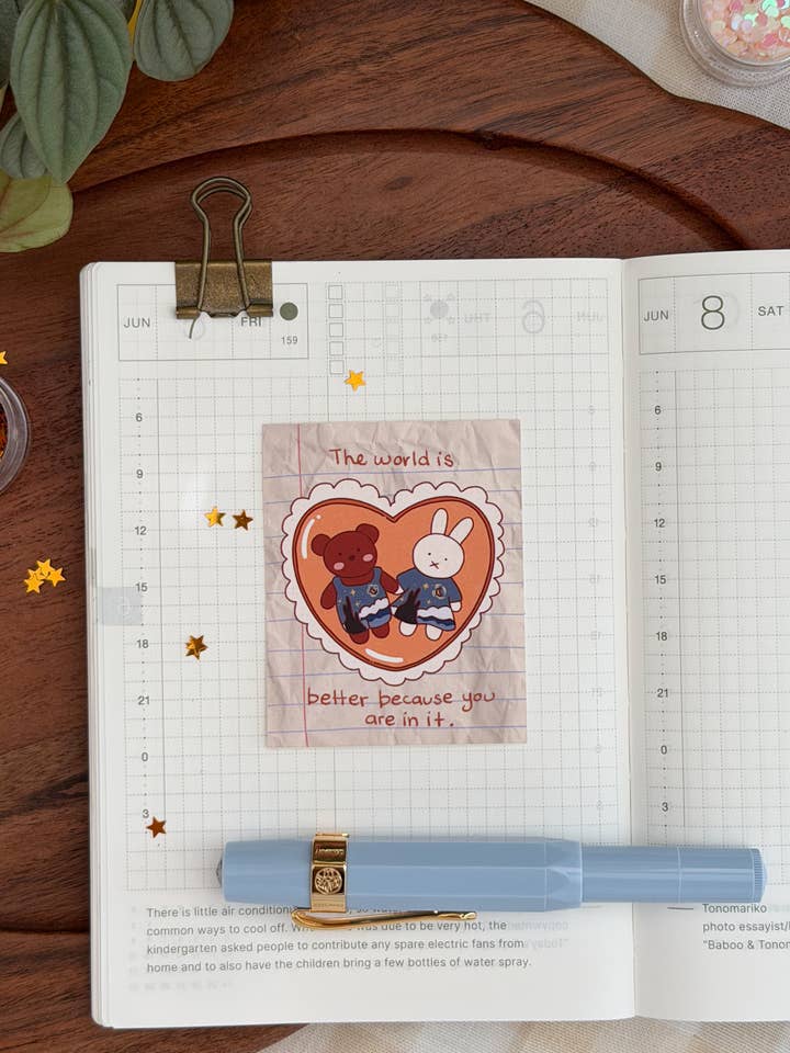 "The world is better because you are in it" Sticker for wholesale by Marlene Vega Studio