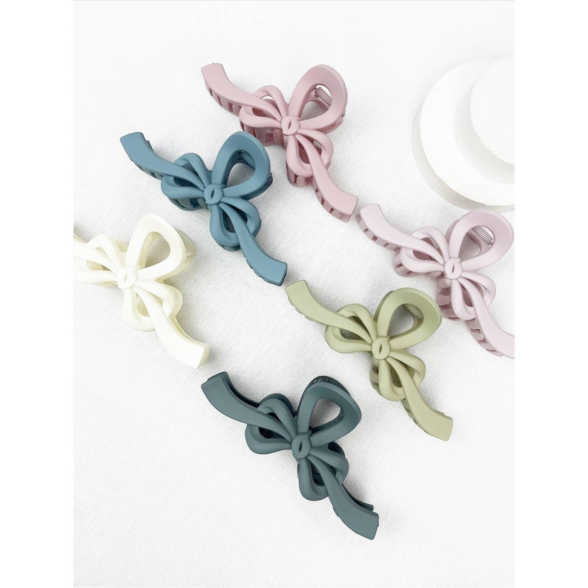 MIX COLOR Knotted Bow Soft Tone Matte Hair Claw for wholesale on Faire4