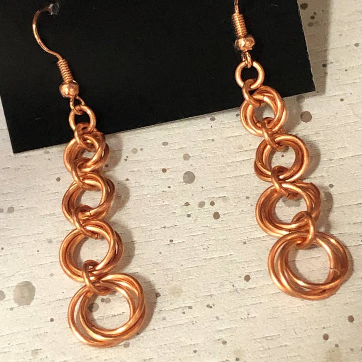 Orecchini pendenti Mobius rame per la vendita all'ingrosso da parte di Impulsive Creativity