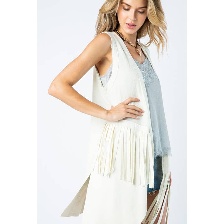 GILET IN CAMOSCIO CON ORLO A FRANGE E APERTURA FRONTALE A BLOCCHI DI COLORE per la vendita all'ingrosso da parte di VOCAL