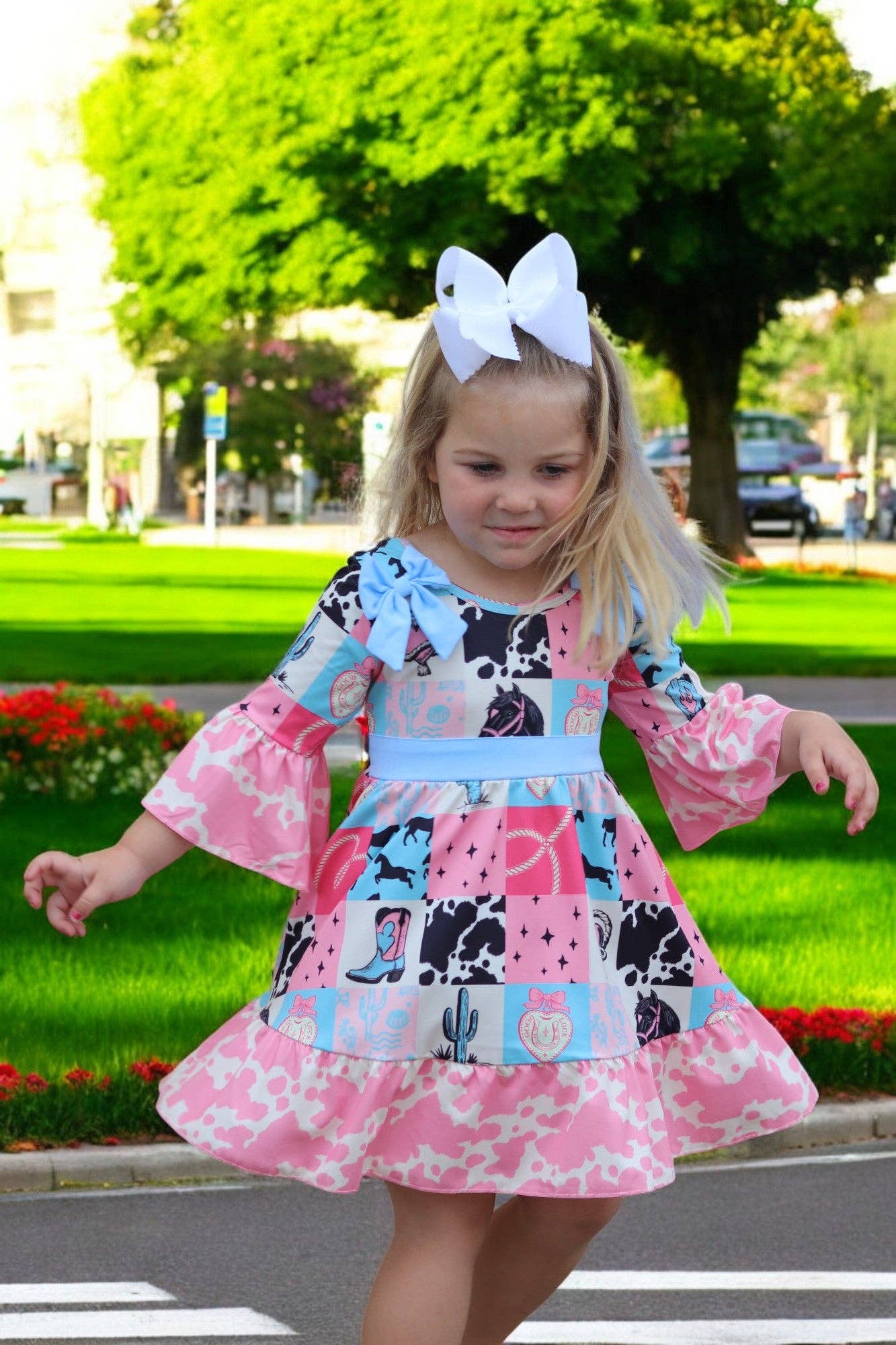 Kids Charm Online - Wholesale Dress - Kids - Beautiful wester patch printed girls dress with bows and cow printed hem.0