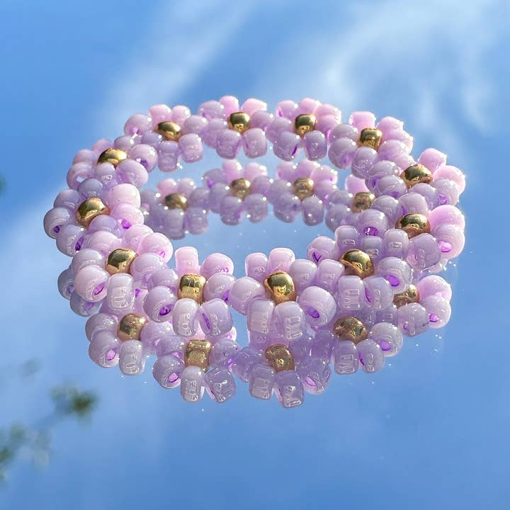 Flower ring "Lilly" made of glass beads in lilac for wholesale by cool people club