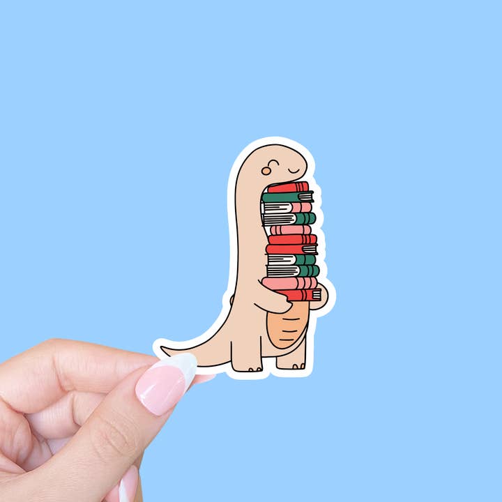 Joli autocollant livresque, autocollant pour ordinateur portable, dinosaure avec livres pour la vente par Radical Buttons
