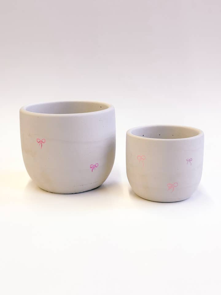 Pink Bow Valentines Concrete Planter With Drainage Hole for wholesale by The Plant Supply