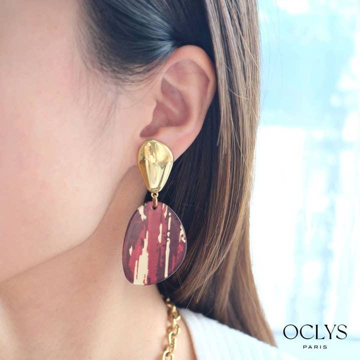 Fania øreringe i guldbelagt rustfrit stål og harpiks for engroshandel hos Oclys