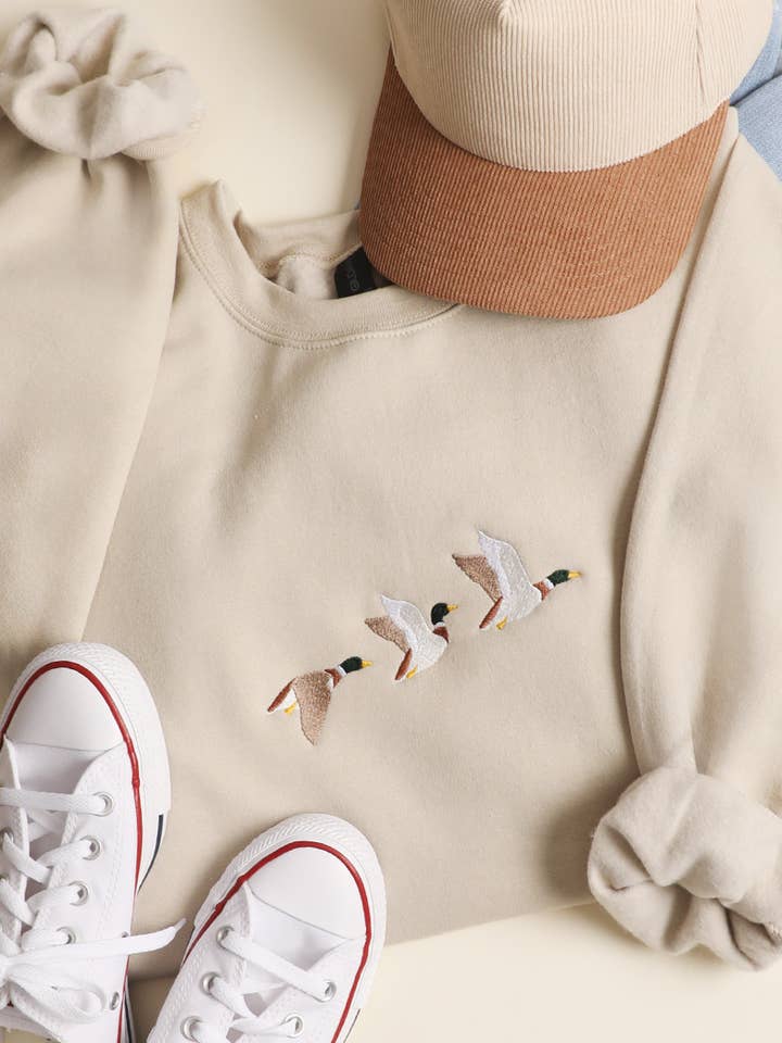 Flying Mallard Embroidered Heavyweight Fleece Sweatshirt and other Purchase Wholesale sequin duck sweatshirt. Free Returns & Net 60 Terms on Faire trending on Faire.