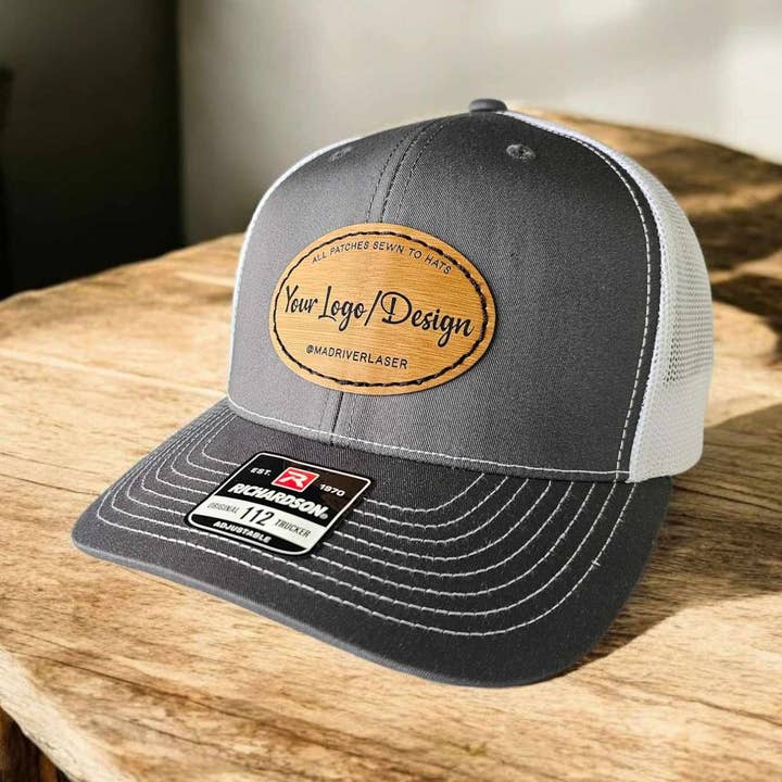 Richardson 112 Trucker Hat w/ Custom Oval Leatherette Patch for wholesale by Mad River