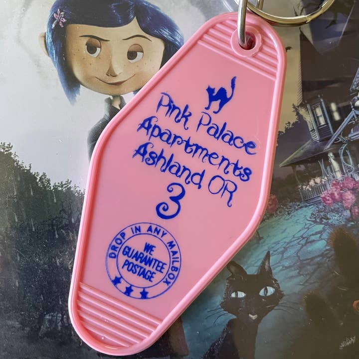 The 3 Sisters Design Co. - Wholesale Keychain - Unisex - Motel Key Fob - Pink Palace Apartments (Coraline)