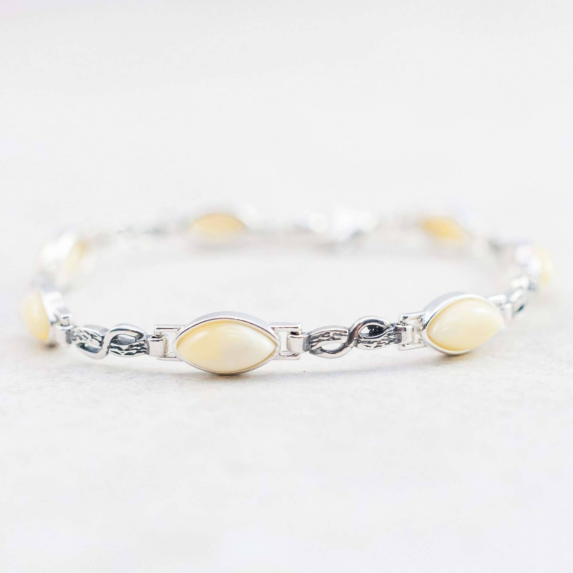 Marcin Waryszak - Vendita all'ingrosso Bracciali tennis - Bracciale in ambra caramellata, braccialetto in argento con maglie a forma di infinito7