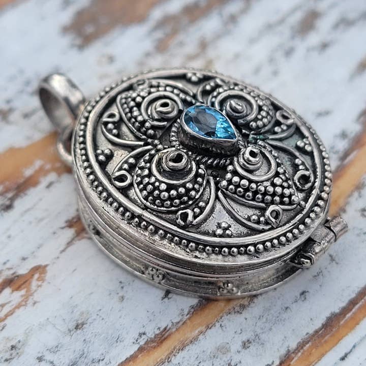 Silver Insanity – wholesale Individual charm/pendant – Oval Blue Topaz Sterling Silver Poison Box Locket Pendant