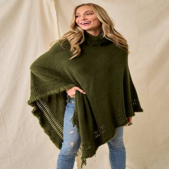 Solid Colored Poncho Sweater with Cable Knit Accent and Frin