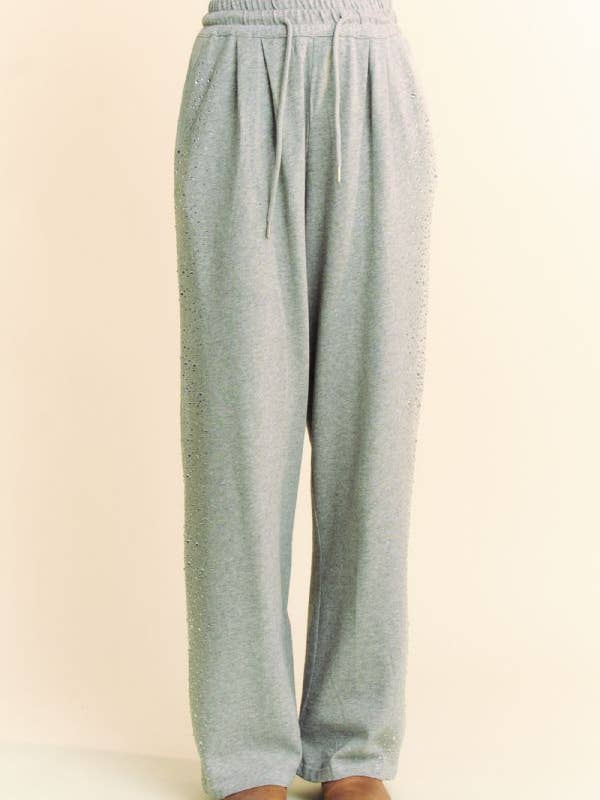 Grigio PANTALONI LUNGHI IN FELPA CON ELASTICO IN VITA CON STRASS in vendita all'ingrosso su Faire
