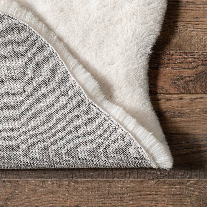 White Eline Faux Sheepskin Machine Washable Area Rug for wholesale on Faire6