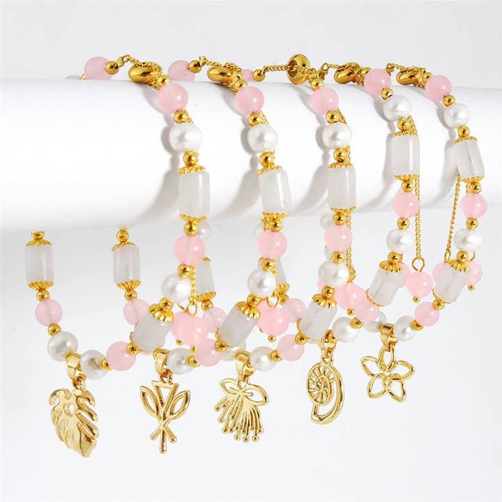 Light Silver Jade Bar And Pearl Bracelet With Light Pink Pearls And Golden Beads In Different Hawaiian Charms for wholesale by S&T Collections