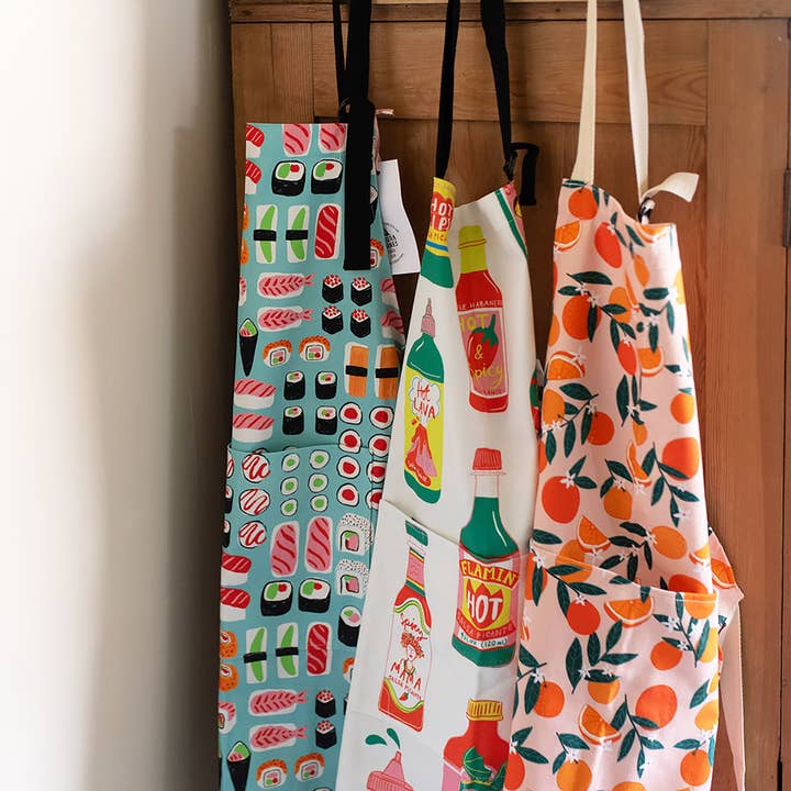 Sevilla Oranges Organic Cotton Apron for wholesale by Laura Barnes Wholesale Ltd