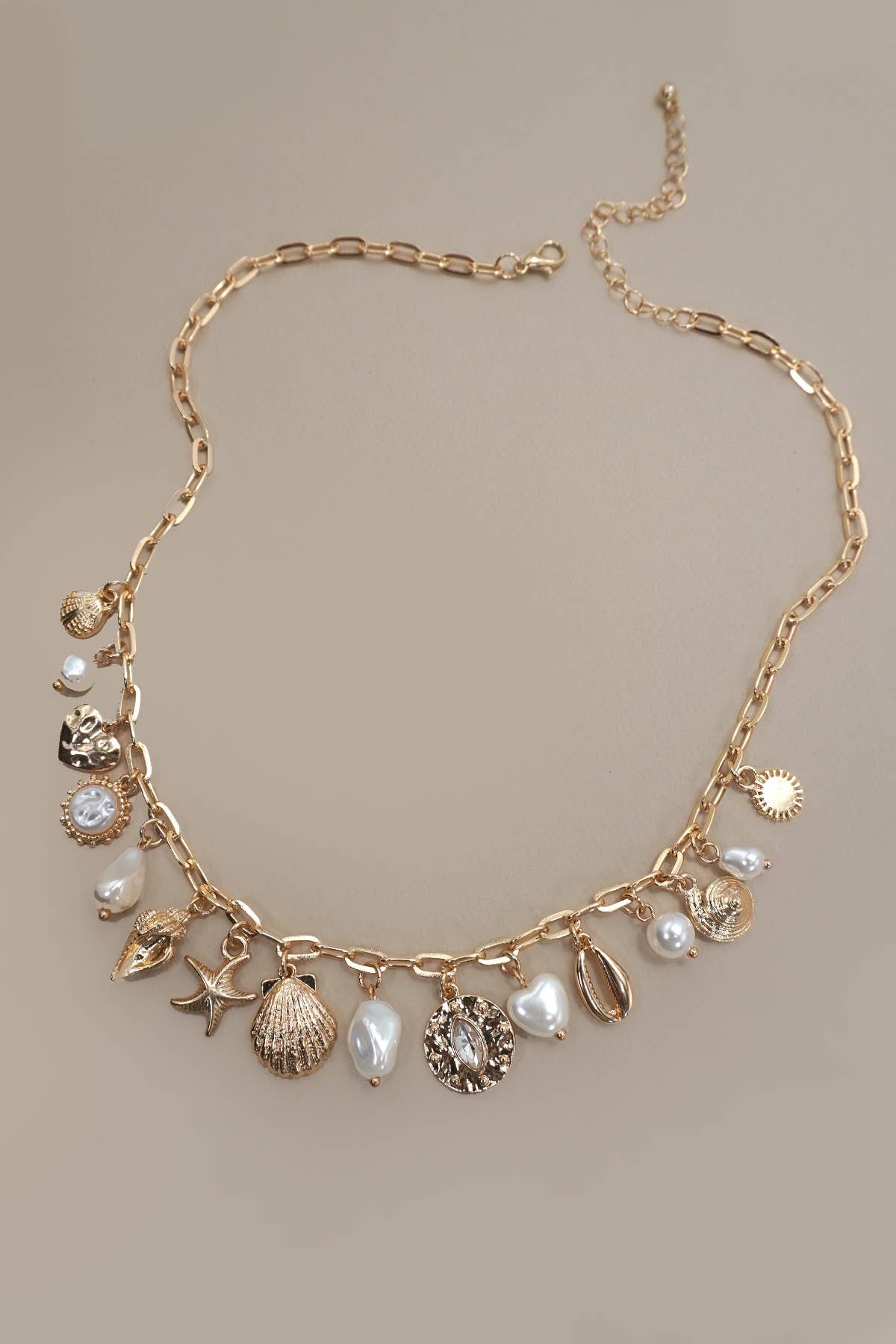 Gold CHARM NECKLACE-SEA SHELL STARFISH PEARL CHARM | 80N91467 for wholesale on Faire1