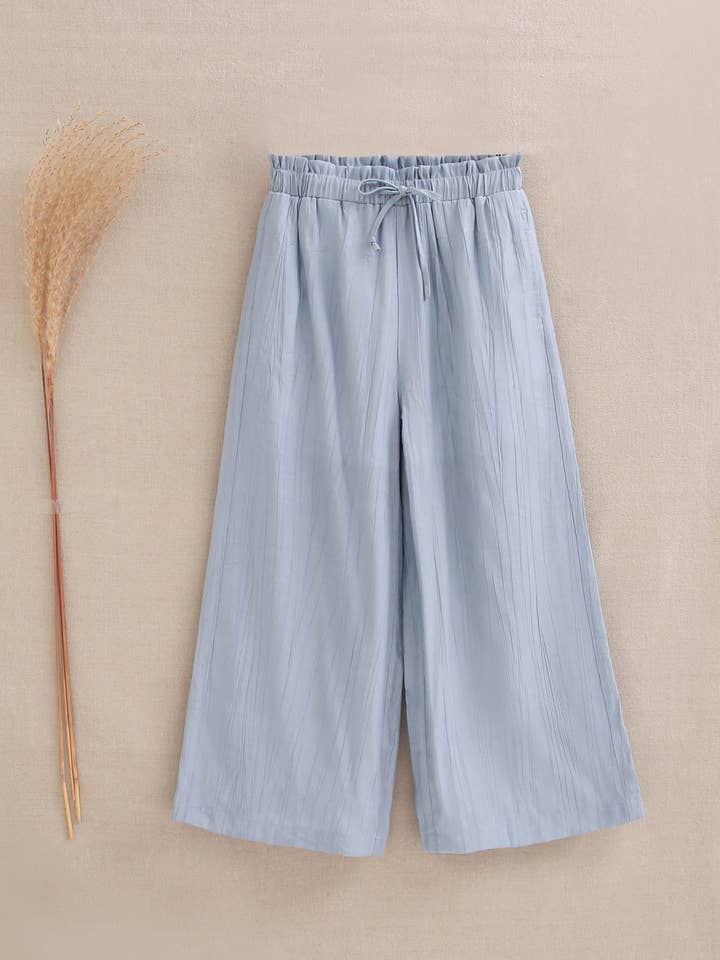 Pastel blue fluid girl's pants for wholesale by Dadati