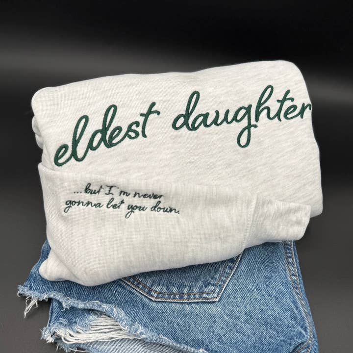 Eldest Daughter Embroidered Crewneck Sweatshirt | Taylor Swift Inspired | “But I’m Never Gonna Let You Down” Lyric Sleeve | Super Soft Bella Canvas Fleece for wholesale by Swain Co. Embroidery & Press