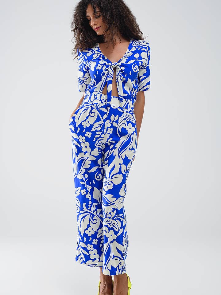 Blå Blå jumpsuit med kort ärm, knytbar nyckelhåls-urringning och blommönster för wholesale på Faire