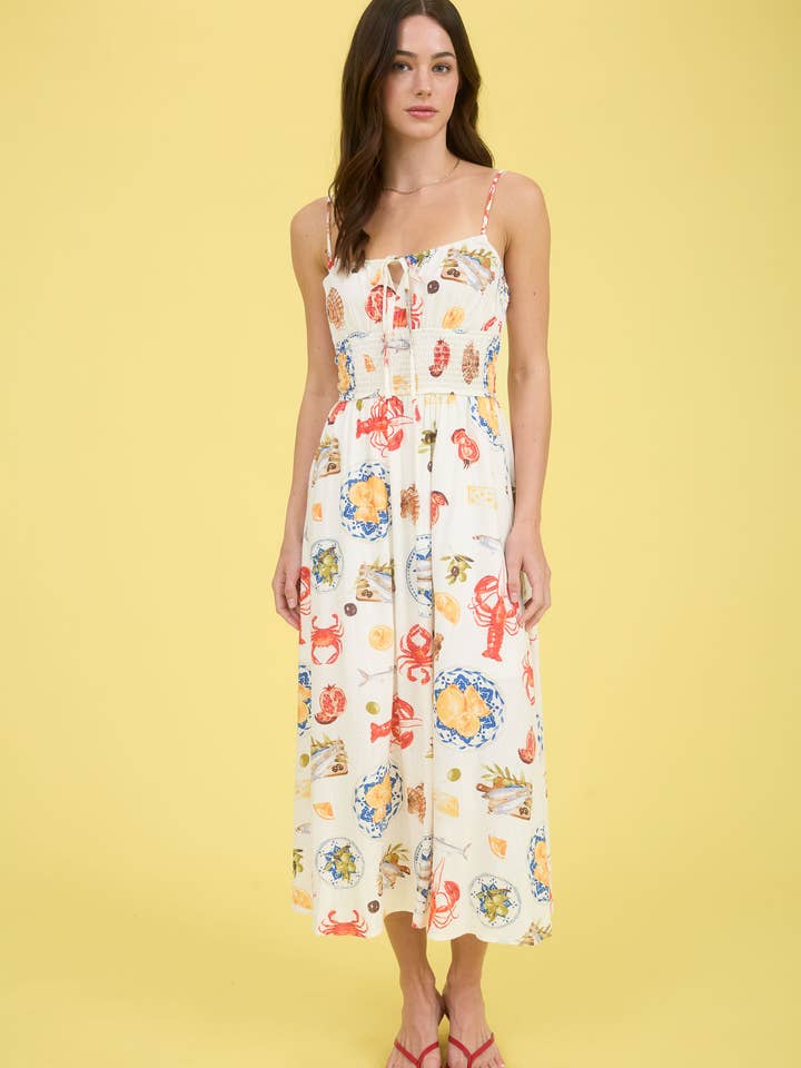 IVORY MULTI SEASIDE LUNCH PRINT SPAGHETTI STRAP MIDI DRESS for wholesale on Faire