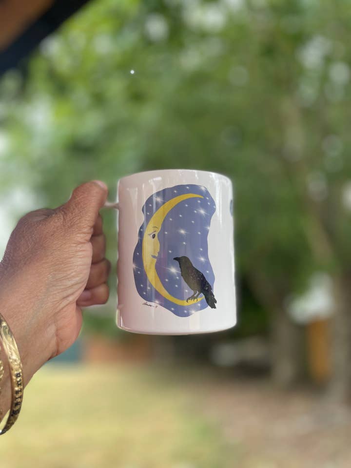 Cawfee First Crow Moon Mug – 15oz Coffee Cup with Crescent Moon Illustration for wholesale by Color Crumbs Club