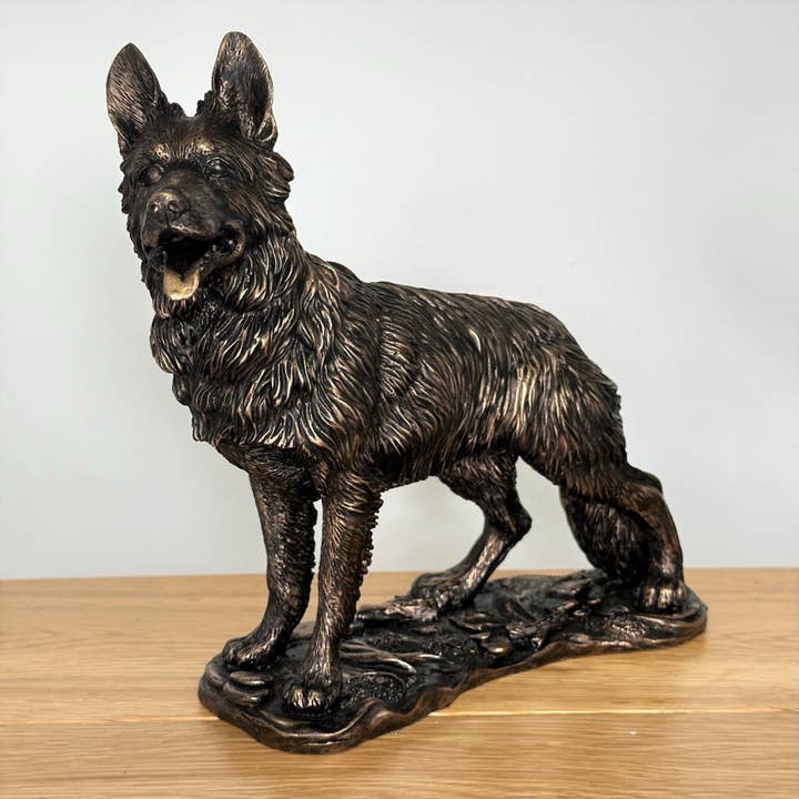 Heavy weight dark bronze effect German Shepherd Dog figurine, 26cm long for wholesale by Animal Crackers