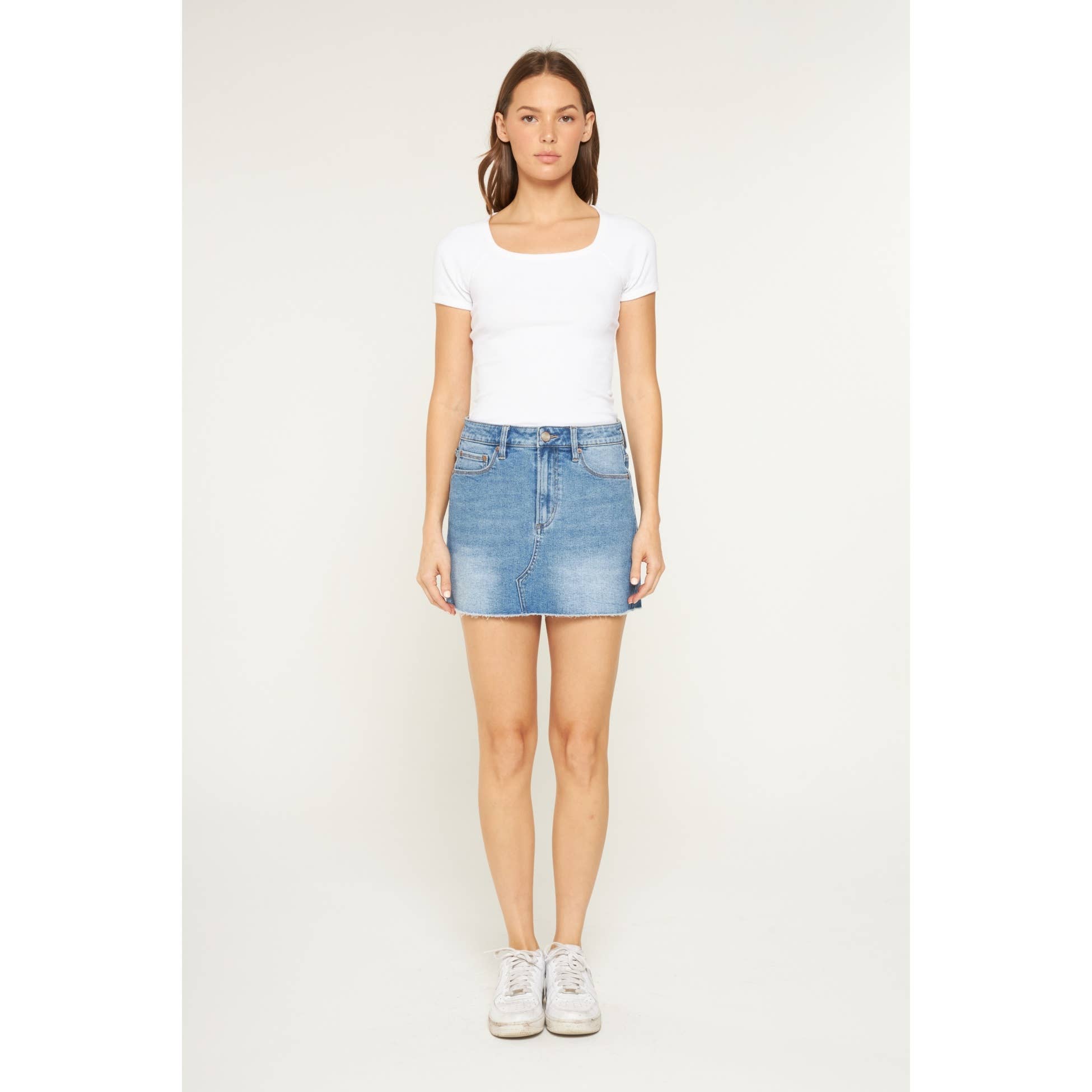 LIGHT SMOG INDIGO HIGH RISE RAW HEM MINI SKIRT for wholesale on Faire1