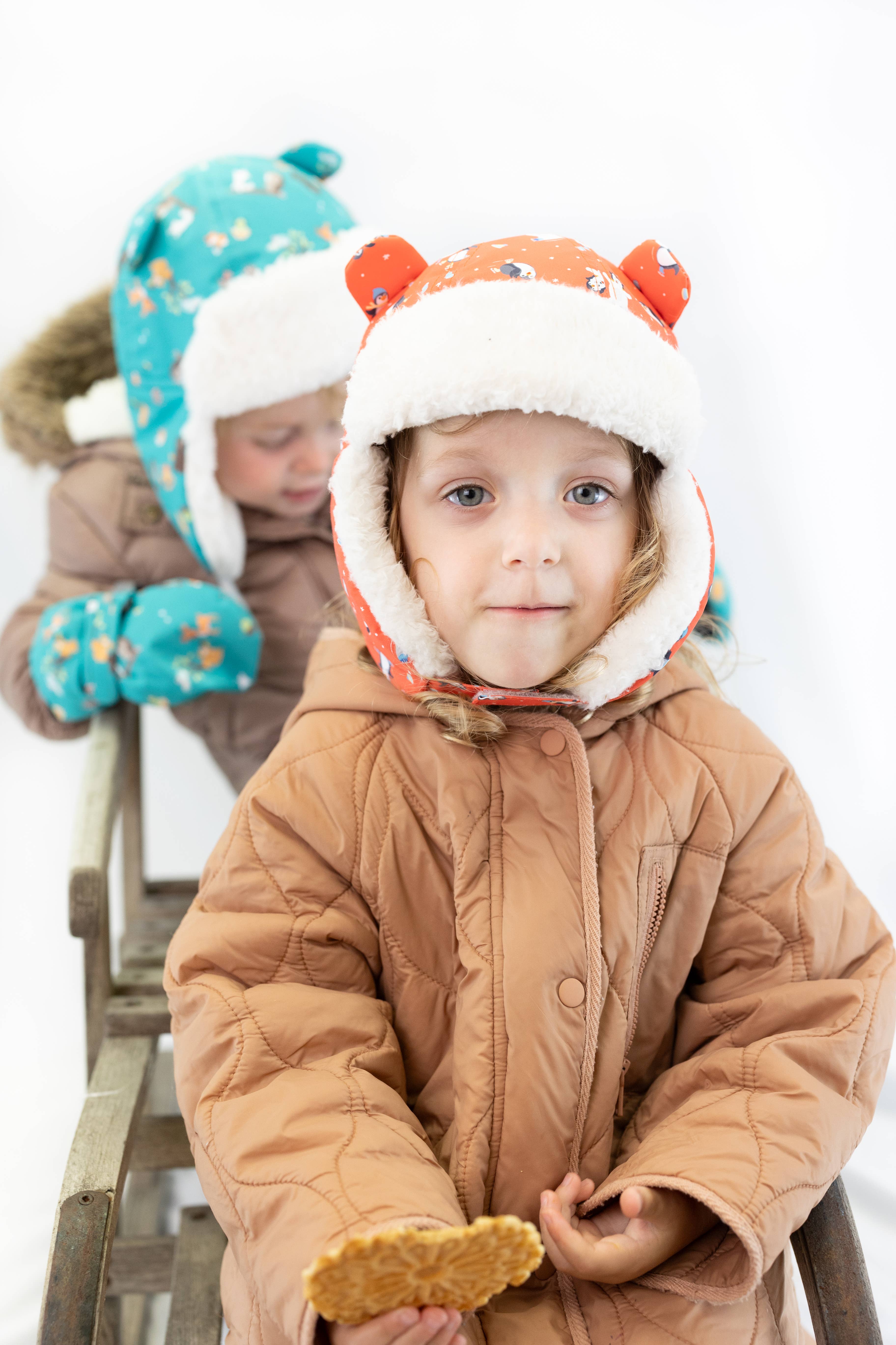 FlapJackKids - Wholesale Trapper/Bomber Hat - Kids - Water Repellent Trapper Hat - Skating Penguin1