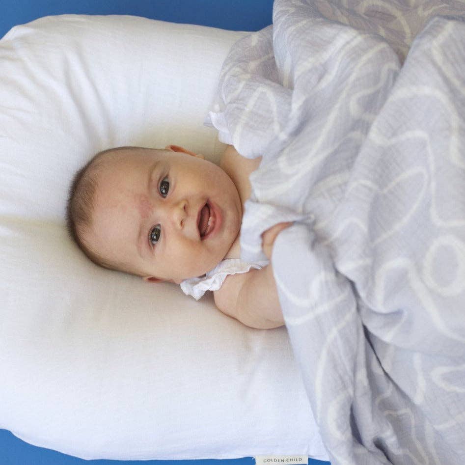 The Laze Organic Cotton Baby Swaddle - Lilac for wholesale on Faire7