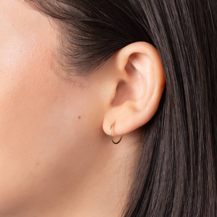 Or Créoles rondes sans fin 14 carats en vente sur Faire1