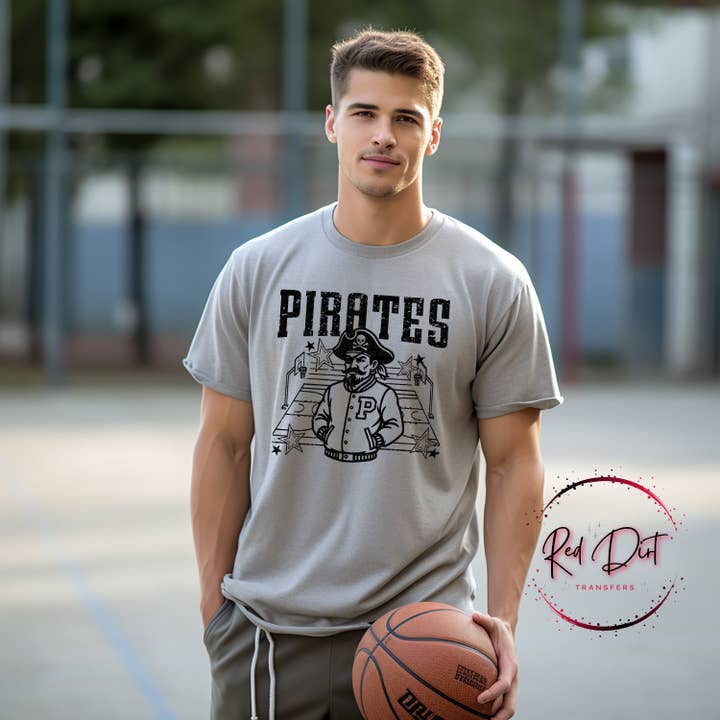 Pirates Basketball Letterman T-Shirt | Trendy School Spirit Shirt | Fast Shipping | Super Soft Shirts for Men/Women/Kid's for wholesale by Red Dirt Transfers
