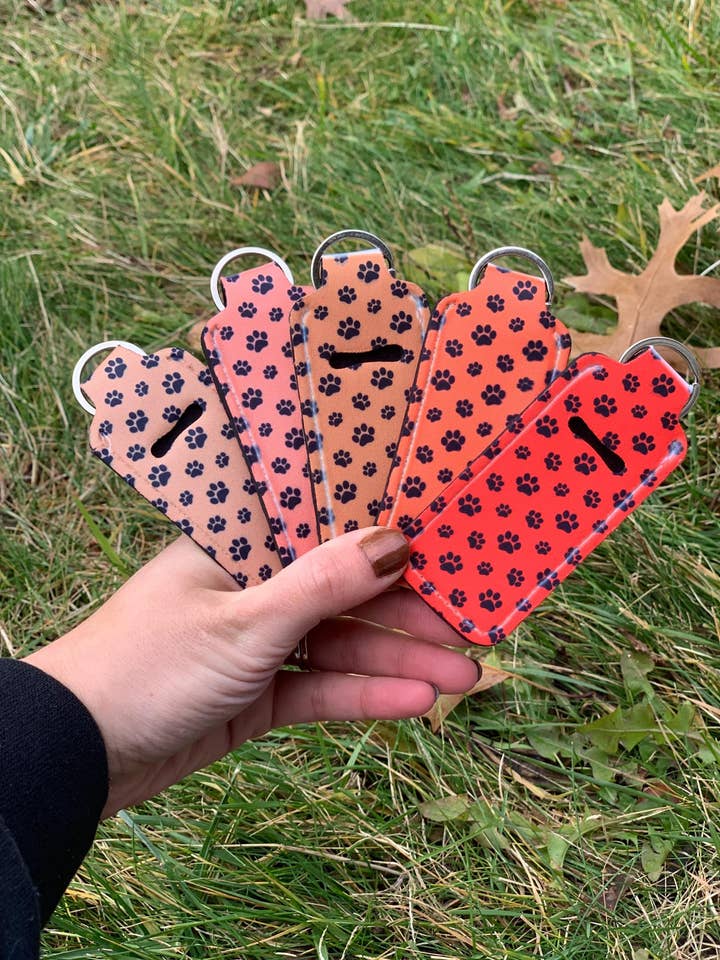 Paw Print Puppy Dog Lover Lip Balm Holder – Custom Keychain for wholesale by The E Tribe Co.