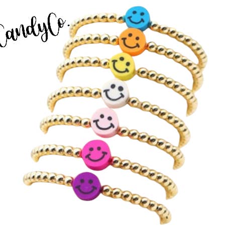 Smiley face trendy stacking Bracelet Spring gold arm candy for wholesale by The Candy Collections