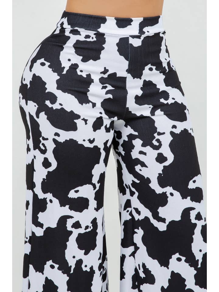 BLACK WHITE B11401 TECHNO CREPE COW PRINT PANTS WITH BACK METAL ZIPPER for wholesale on Faire1