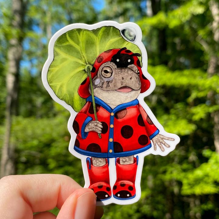 Raincoat Toad Weatherproof Vinyl Sticker for wholesale by Allison Stoiser Art