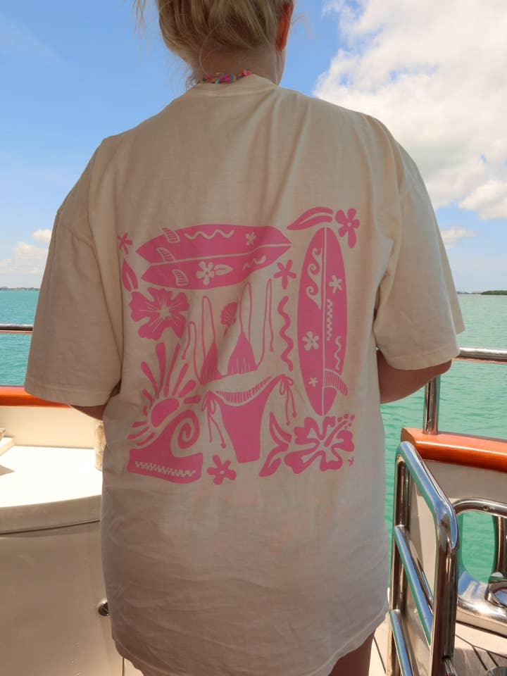 Ivory Pink Swim And Surf Comfort Colors Tee for wholesale on Faire4